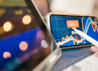 Trader across multiple markets examining Bitcoin, Ethereum, and forex options